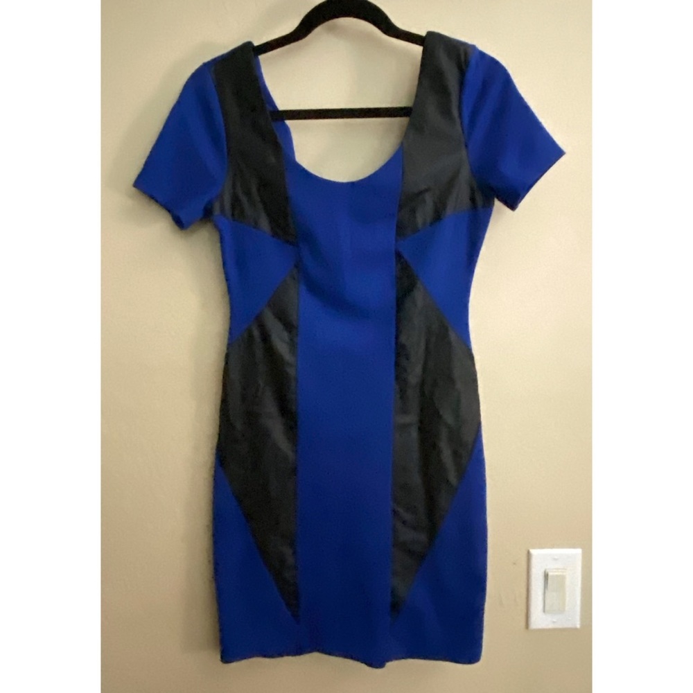 2B Bebe vegan leather patch work dress with short sleeves.